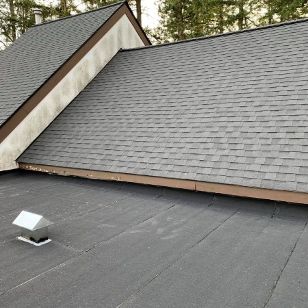 Asphalt gray colored shingles on a residential home installed by Busy Boys Roofing LTD
