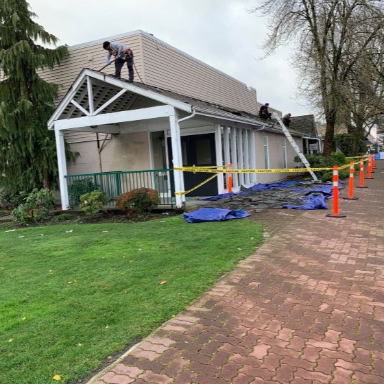 Asphalt gray colored shingles on a residential home installed by Busy Boys Roofing LTD
